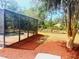 Enjoy the view of the screened pool, patio, and backyard from this angle at 2630 S Tanner Rd, Orlando, FL 32820