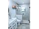 Beautiful bathroom featuring marble style tile, a glass shower, and modern fixtures at 2630 S Tanner Rd, Orlando, FL 32820
