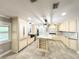 Spacious kitchen with marble counter tops, tiled floors, and modern appliances at 2630 S Tanner Rd, Orlando, FL 32820