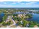 Wide angle view of residential lake community, highlighting the lush greenery and waterways at 2916 Maldive Ct, Deltona, FL 32738