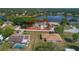 Aerial view highlighting property lines, nearby lake, and pool area at 2916 Maldive Ct, Deltona, FL 32738
