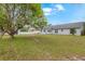 Expansive backyard with a view of the house and storage shed at 2916 Maldive Ct, Deltona, FL 32738