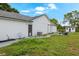 Exterior backyard featuring green grass, a shed, and patio furniture at 2916 Maldive Ct, Deltona, FL 32738