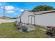 Cozy backyard featuring an outdoor seating area and a well-maintained lawn at 2916 Maldive Ct, Deltona, FL 32738