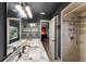 Bathroom with double sinks, marble countertop, and tiled shower stall at 2916 Maldive Ct, Deltona, FL 32738