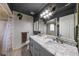 Bathroom featuring marble counters, modern fixtures, and a large mirror at 2916 Maldive Ct, Deltona, FL 32738