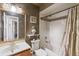 Bathroom featuring a bathtub and shower, toilet, and vanity with a mirror at 2916 Maldive Ct, Deltona, FL 32738