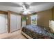 Comfortable bedroom featuring tile floors, ceiling fan and window for natural light at 2916 Maldive Ct, Deltona, FL 32738