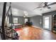 Spacious bedroom with a ceiling fan, gray walls, and a doorway to the outside at 2916 Maldive Ct, Deltona, FL 32738