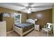 Comfortable bedroom with neutral tones, tile floors, and natural light at 2916 Maldive Ct, Deltona, FL 32738