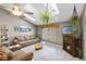 Comfortable living room with vaulted ceiling, fireplace, and tile flooring at 2916 Maldive Ct, Deltona, FL 32738