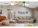 Inviting living room featuring tile flooring, comfortable seating, and skylight at 2916 Maldive Ct, Deltona, FL 32738