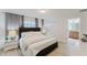 Comfortable bedroom with an ensuite bathroom, modern decor, and lots of natural light at 2923 Banana Palm Dr, Kissimmee, FL 34747