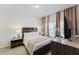 Cozy bedroom with contemporary furniture, warm lighting, and decorative plants at 2923 Banana Palm Dr, Kissimmee, FL 34747
