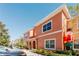 Charming two-story townhome in a well-maintained community, enhanced by lush landscaping and a sunny sky at 2923 Banana Palm Dr, Kissimmee, FL 34747