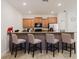 Kitchen view of breakfast bar seating for four with stainless steel appliances at 2923 Banana Palm Dr, Kissimmee, FL 34747