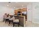 Kitchen bar seating with granite countertops and stainless steel appliances at 2923 Banana Palm Dr, Kissimmee, FL 34747