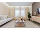 Cozy living room boasts modern furniture, decorative accents, and soft, neutral tones at 2923 Banana Palm Dr, Kissimmee, FL 34747
