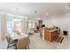 Open-concept living space with dining area, modern kitchen, and comfortable seating at 2923 Banana Palm Dr, Kissimmee, FL 34747