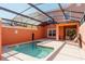 Private screened-in pool with patio and outdoor dining provides a relaxing retreat at 2923 Banana Palm Dr, Kissimmee, FL 34747