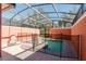Backyard pool with screen enclosure and privacy fence, great for outdoor fun and relaxation at 2923 Banana Palm Dr, Kissimmee, FL 34747