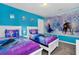 Playful bedroom features 'Frozen' themed beds and decor creating a vibrant and inviting space at 3082 Mahalo Dr, Davenport, FL 33897