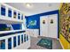 Bright bedroom features a white bunk bed with a fun Minions theme and an entertainment center at 3082 Mahalo Dr, Davenport, FL 33897