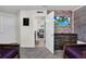 Themed bedroom features a brick wall and a doorway to the ensuite bathroom at 3082 Mahalo Dr, Davenport, FL 33897