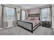 Bedroom with queen bed, neutral walls, and large window with blinds at 3082 Mahalo Dr, Davenport, FL 33897