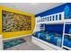 Bright bedroom features a white bunk bed with a fun Minions themed bed set at 3082 Mahalo Dr, Davenport, FL 33897