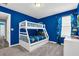 Bright bedroom features a white bunk bed and fun Minions theme at 3082 Mahalo Dr, Davenport, FL 33897