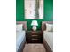 Bedroom with two beds, an accent wall, and a nightstand in between at 3082 Mahalo Dr, Davenport, FL 33897