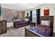 This themed bedroom features two twin beds with a rustic wood finish at 3082 Mahalo Dr, Davenport, FL 33897