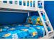 A close up of the bunk bed features a fun Minions themed bed set at 3082 Mahalo Dr, Davenport, FL 33897