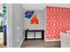 Charming entryway with unique wall decor that leads to the dining area and outdoor space at 3082 Mahalo Dr, Davenport, FL 33897