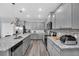 Well-equipped kitchen with granite countertops, stainless steel appliances, and ample cabinet space for storage at 3082 Mahalo Dr, Davenport, FL 33897