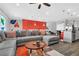 Spacious living room with open floor plan, leading to dining area and kitchen, perfect for entertaining at 3082 Mahalo Dr, Davenport, FL 33897