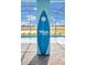 Resort-style pool area featuring custom surfboard art creates a tropical paradise perfect for relaxation and fun at 3082 Mahalo Dr, Davenport, FL 33897