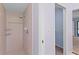 This bathroom features a tiled shower with a showerhead and built-in shelving unit at 3150 Rider Pl, Orlando, FL 32817