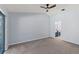 Bedroom with carpet, neutral walls, and a sliding glass door and access to an ensuite bathroom at 3150 Rider Pl, Orlando, FL 32817