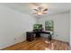 This bedroom has a ceiling fan, a window, and laminate flooring at 3150 Rider Pl, Orlando, FL 32817