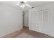 Carpeted bedroom with closet, ceiling fan and access to other rooms at 3150 Rider Pl, Orlando, FL 32817