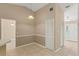 Dining area featuring tiled floor, neutral walls, and entry to the front door and access to other rooms at 3150 Rider Pl, Orlando, FL 32817