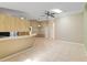 Open-concept living area featuring tiled floors, a breakfast bar, and views of other areas in the home at 3150 Rider Pl, Orlando, FL 32817