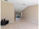 Open-concept room offering a seamless flow with tile flooring, neutral walls, and a view of the screened-in pool at 3150 Rider Pl, Orlando, FL 32817