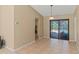 Open layout dining room featuring ceramic tile, neutral walls, and sliding glass doors leading to screened-in lanai at 3150 Rider Pl, Orlando, FL 32817