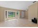 Inviting living room with ceramic tile floors, neutral walls and a large bay window at 3150 Rider Pl, Orlando, FL 32817