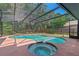 Large screened pool with spa, ideal for year-round enjoyment and outdoor gatherings at 3150 Rider Pl, Orlando, FL 32817