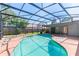 A sparkling screened pool and spa combination create a backyard paradise at 3150 Rider Pl, Orlando, FL 32817