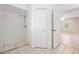 Full bathroom with a shower, white tile and doorway looking into a bedroom at 3304 Vancouver Ave, Deltona, FL 32738